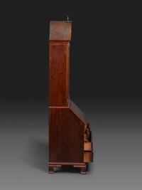 A Chippendale Figured Mahogany Bonnet Top Desk-and-Bookcase