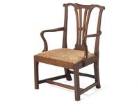 A Chippendale Carved Walnut and Elm Armchair