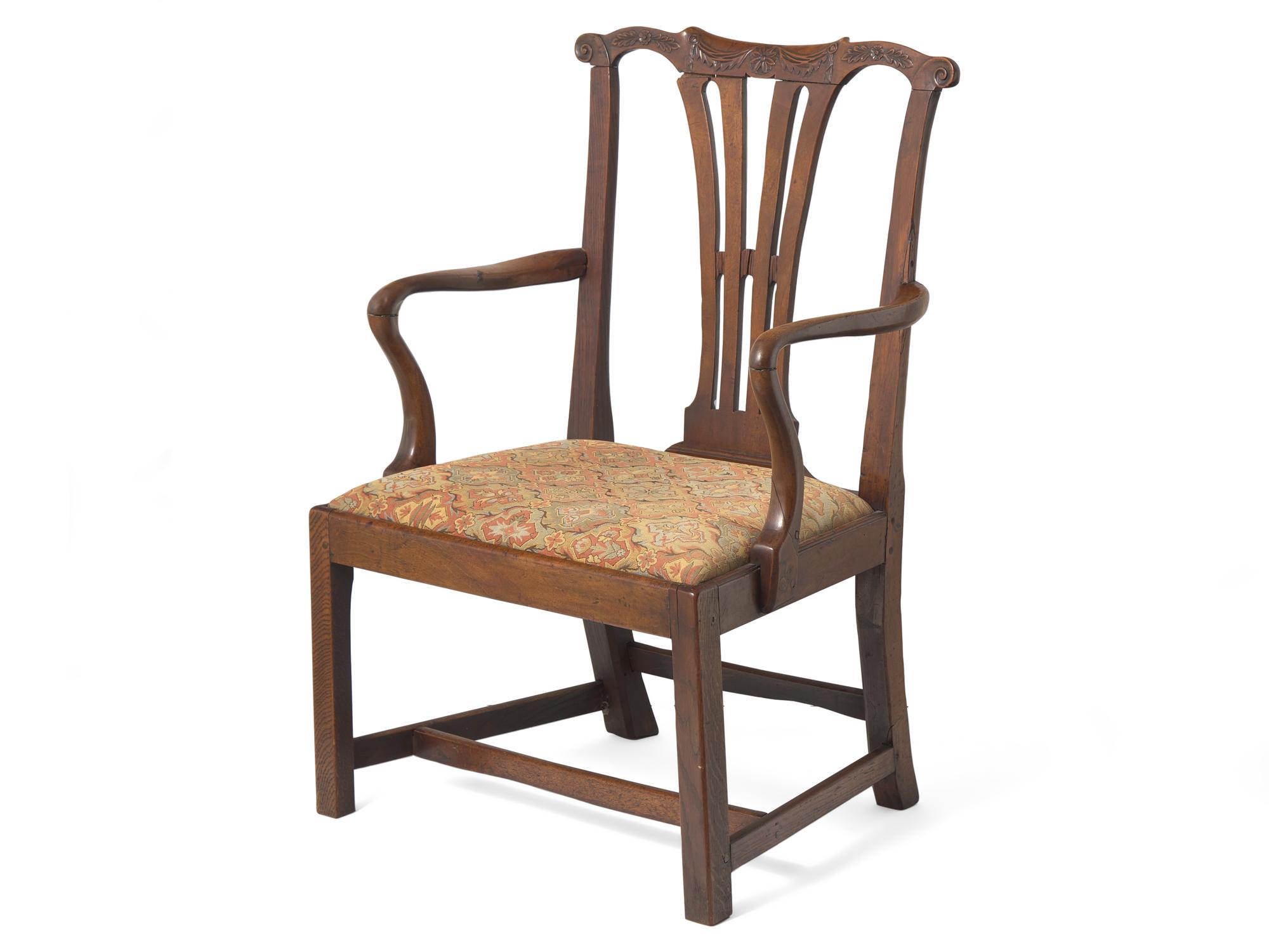 A Chippendale Carved Walnut and Elm Armchair