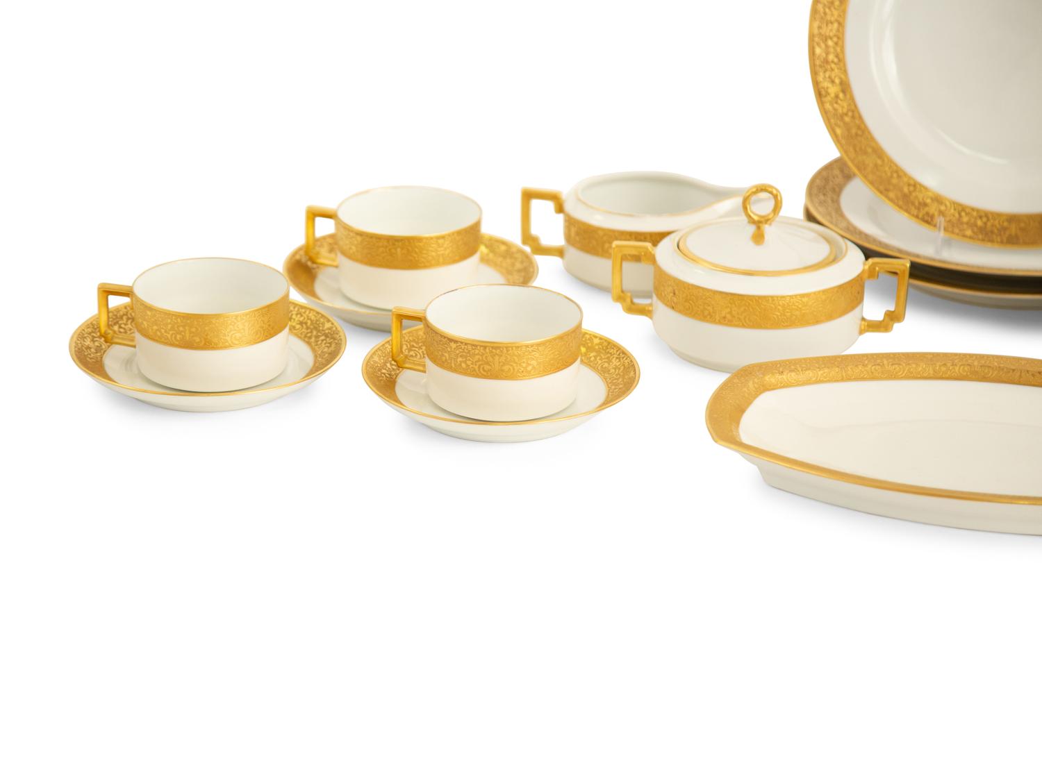 A Bavarian Gilt Decorated Porcelain Dinner Service