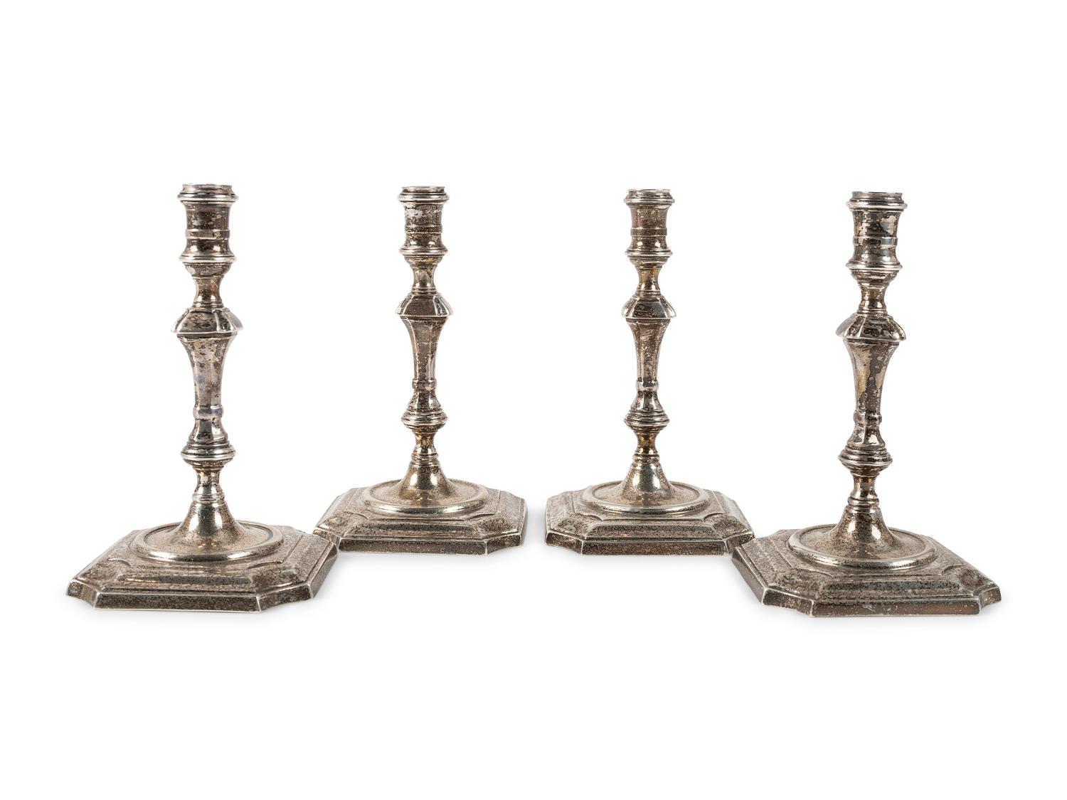 A Set of Four Currier & Roby Silver Taper Sticks