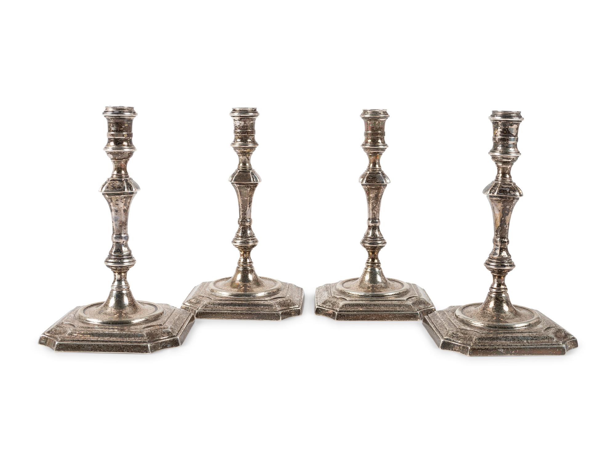 A Set of Four Currier & Roby Silver Taper Sticks