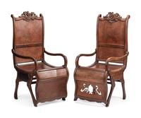 A Pair of Portuguese Colonial Carved Walnut Reclining Armchairs