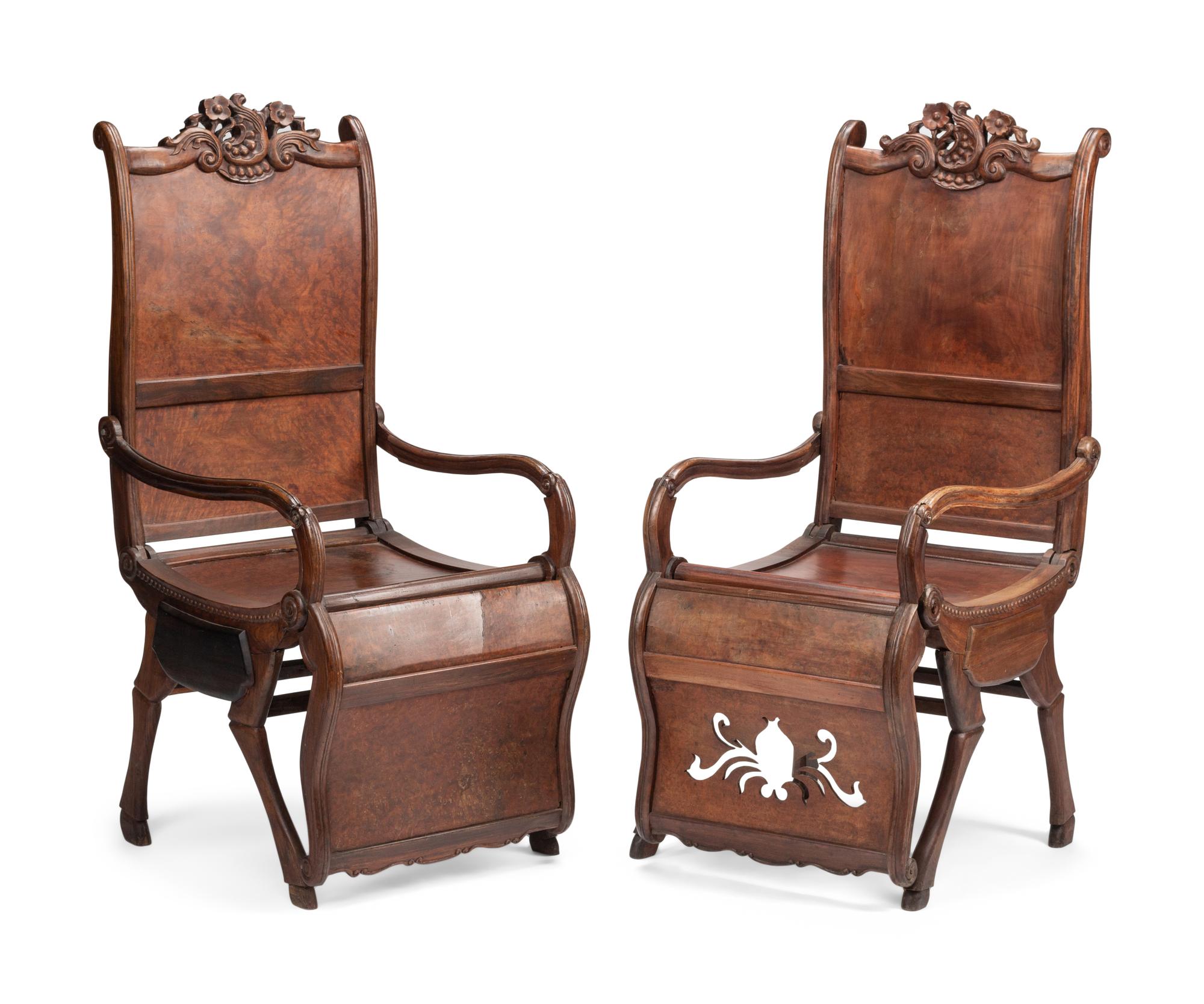 A Pair of Portuguese Colonial Carved Walnut Reclining Armchairs