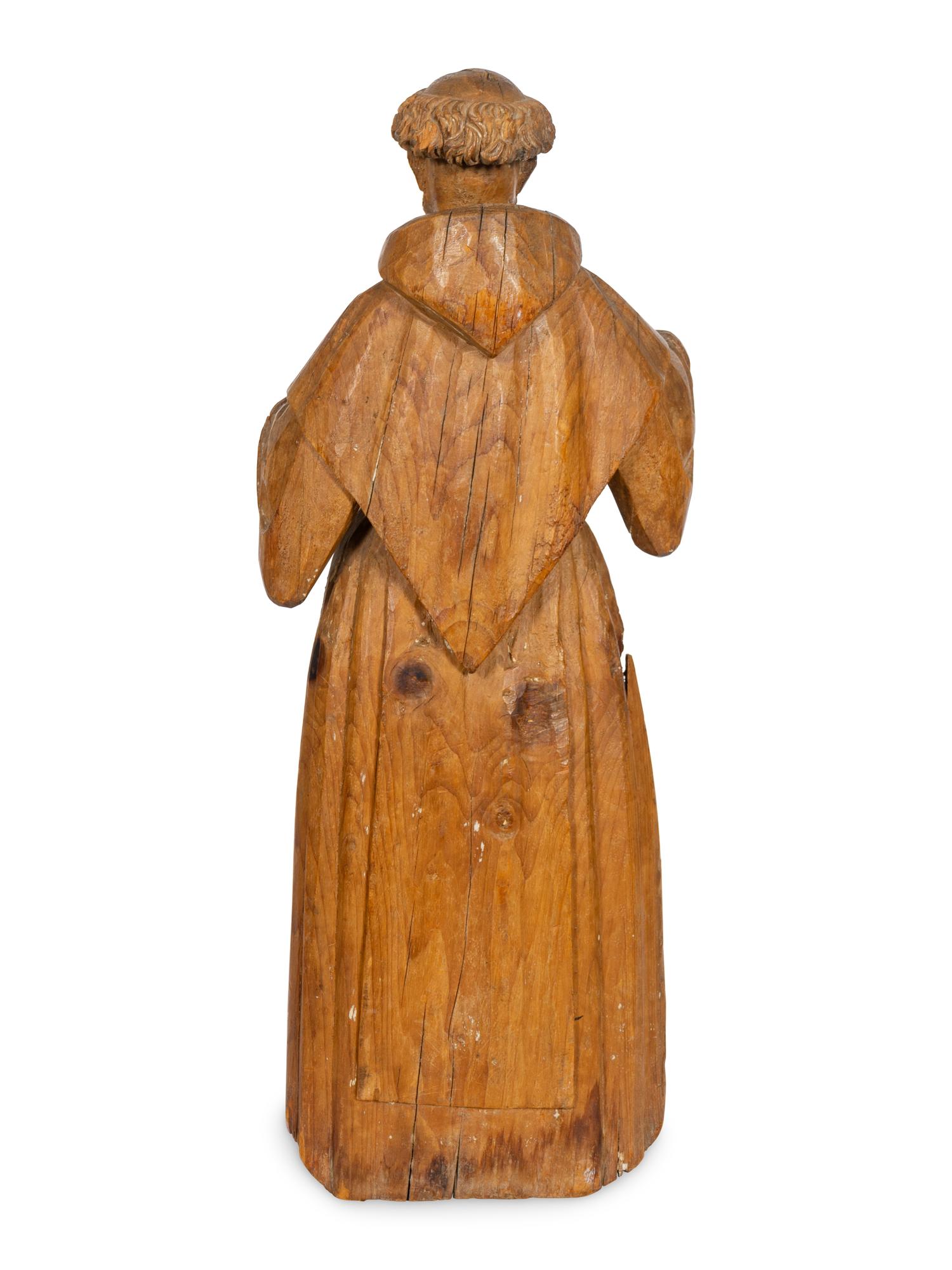 A Continental Carved Santos Figure