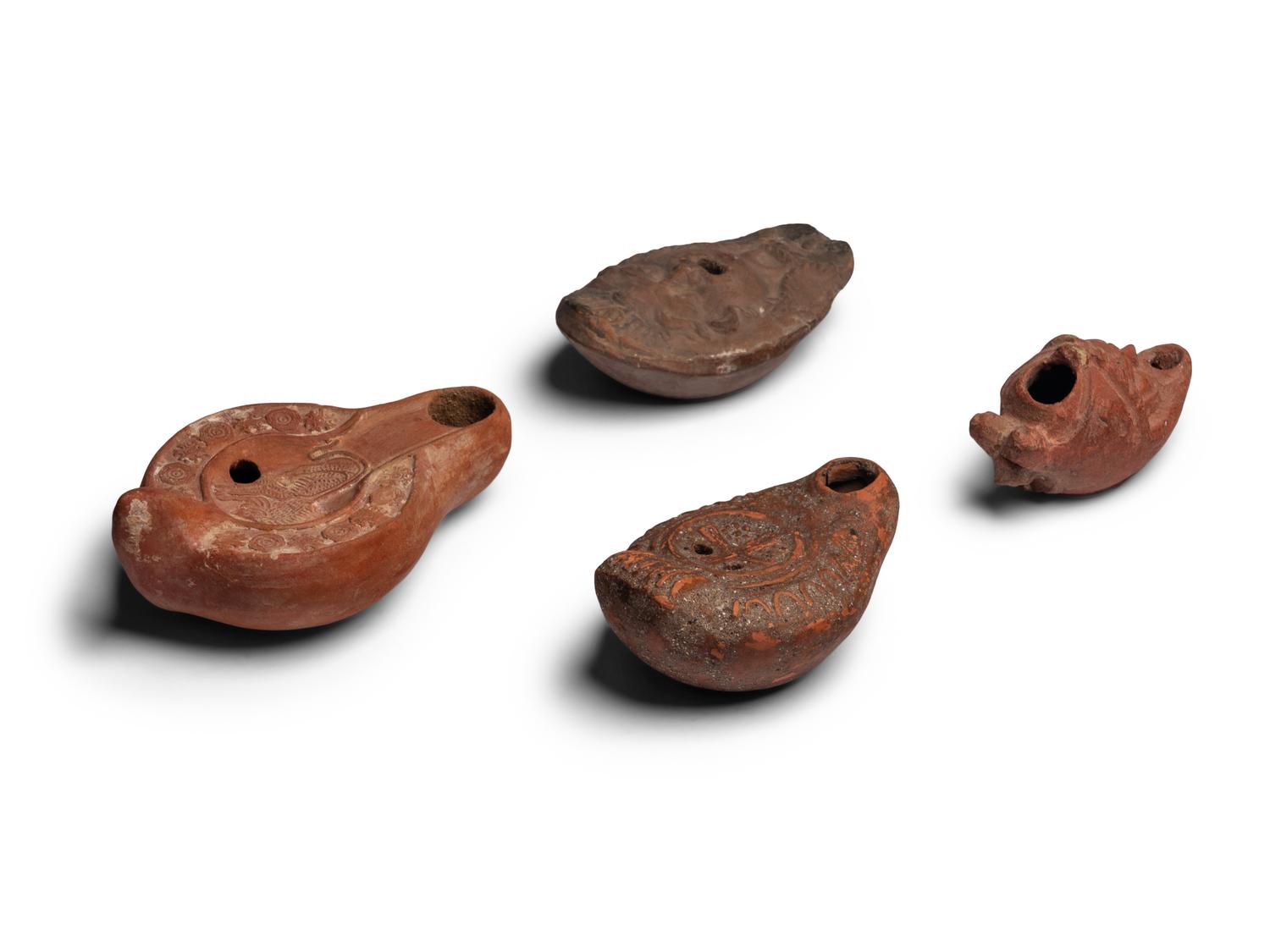 Four Roman Terracotta Oil Lamps