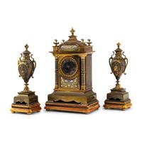 A French Brass and Mixed Metals Clock Garniture