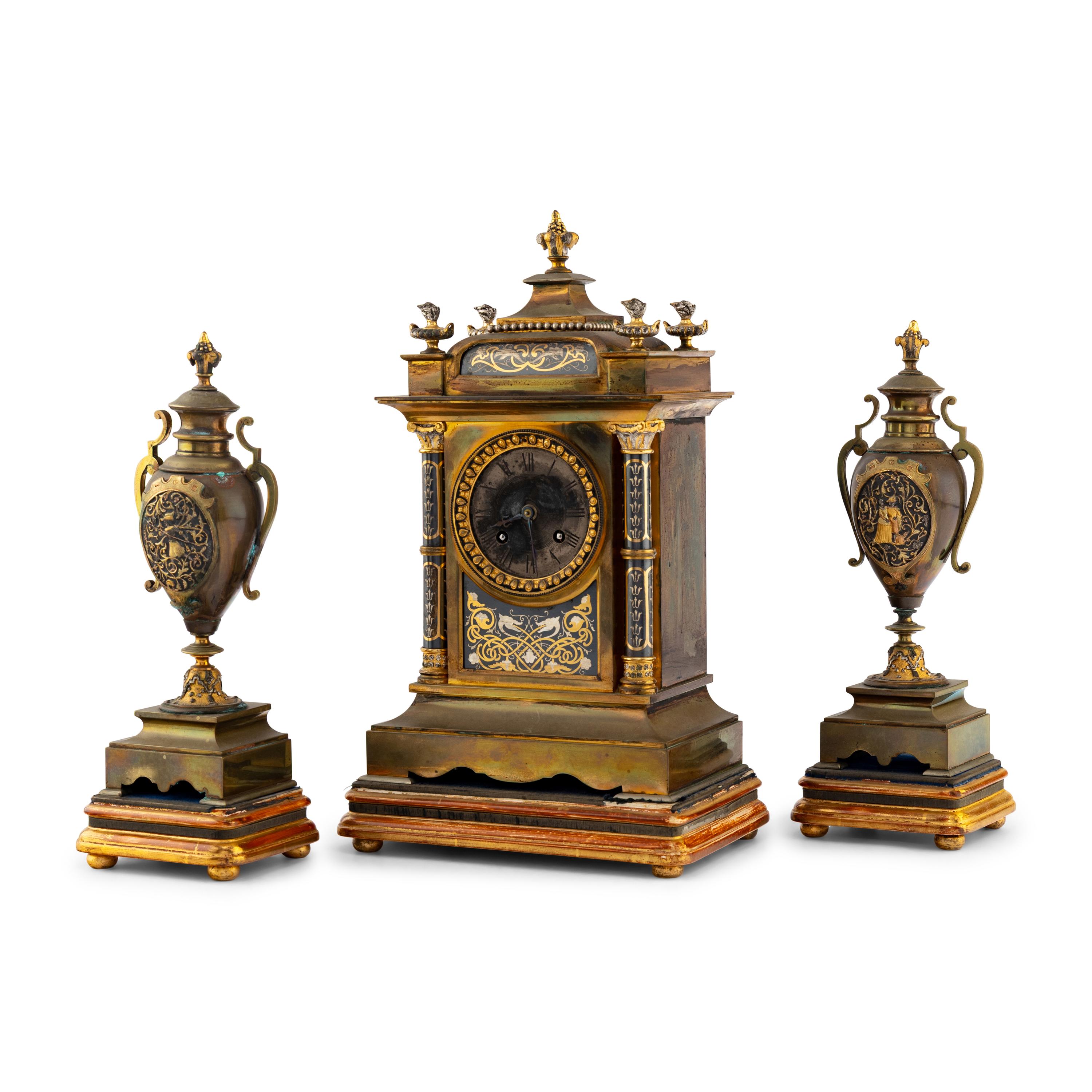 A French Brass and Mixed Metals Clock Garniture