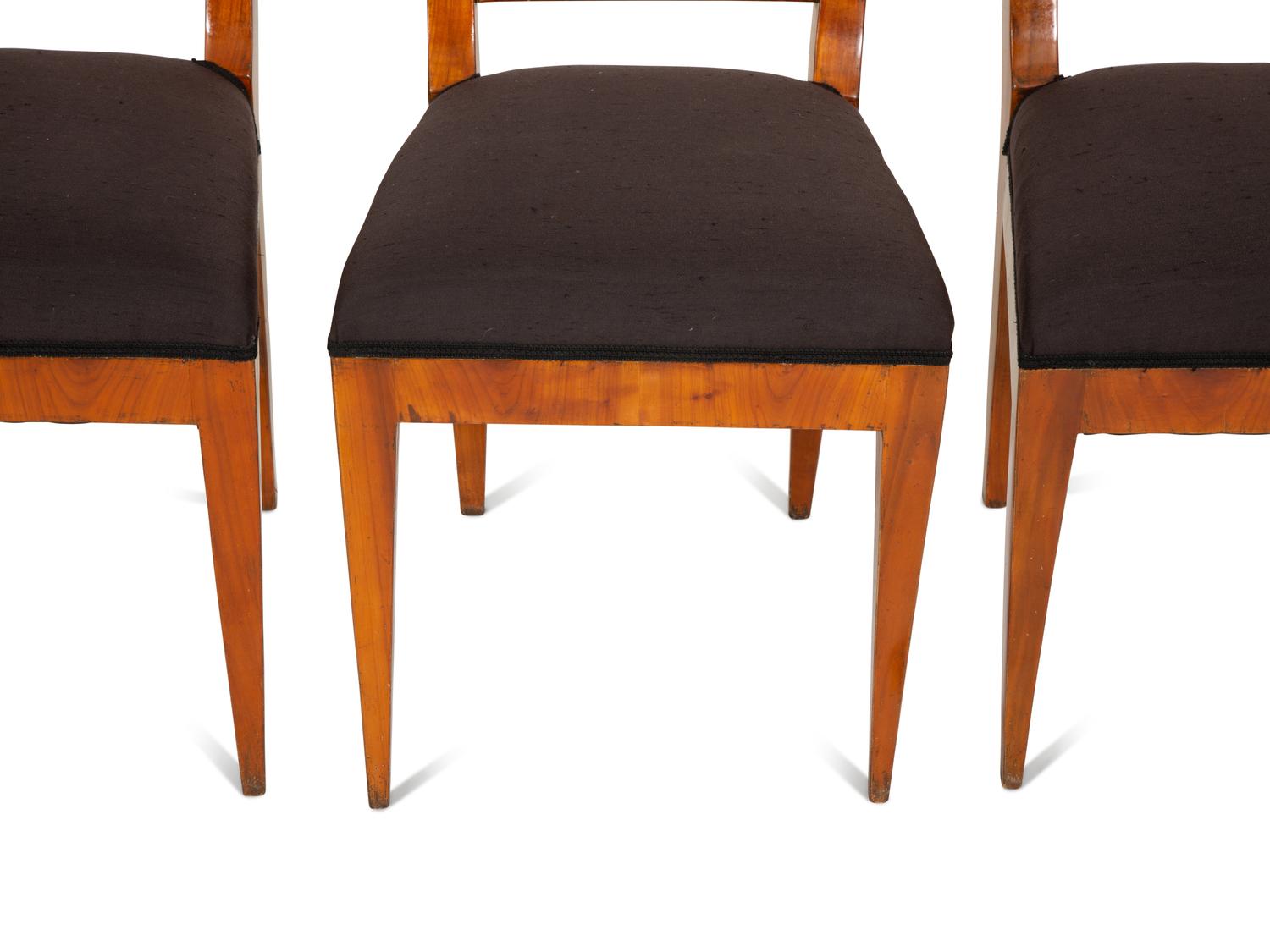 A Set of Four Biedermeier Part Ebonized Fruitwood Dining Chairs