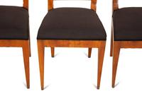 A Set of Four Biedermeier Part Ebonized Fruitwood Dining Chairs