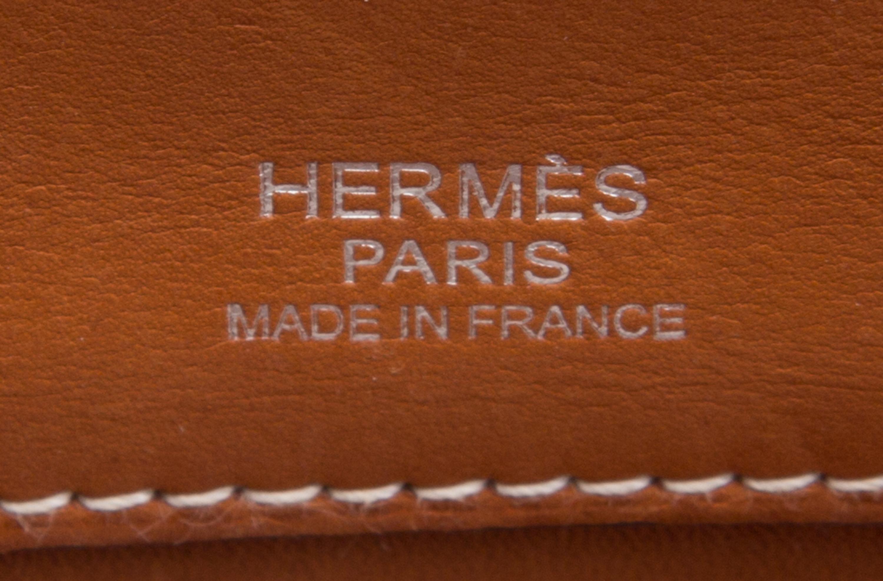 An Hermes Brown Leather and Canvas 35cm Atlas Handbag, 14" x 12" x 5".