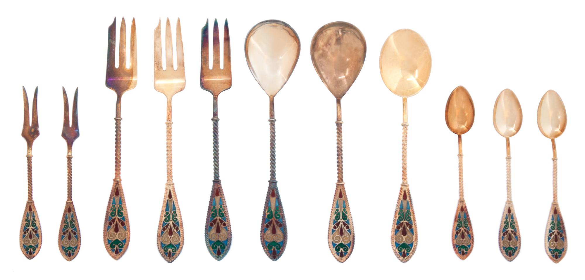 Eleven Norwegian Plique a Jour Handled Silver Gilt Flatware, Johan G. Kjaerland, Bergen, Norway, comprising three sugar spoons, three s