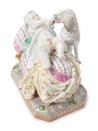 A Meissen Porcelain Figural Group of a Child in Bed with Dog