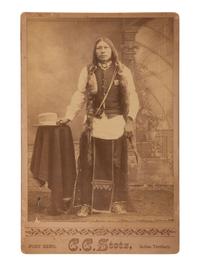 [NATIVE AMERICANS]. Cabinet card of an Arapahoe agency police officer. Fort Reno, Indian Territory: C.C. Stotz.