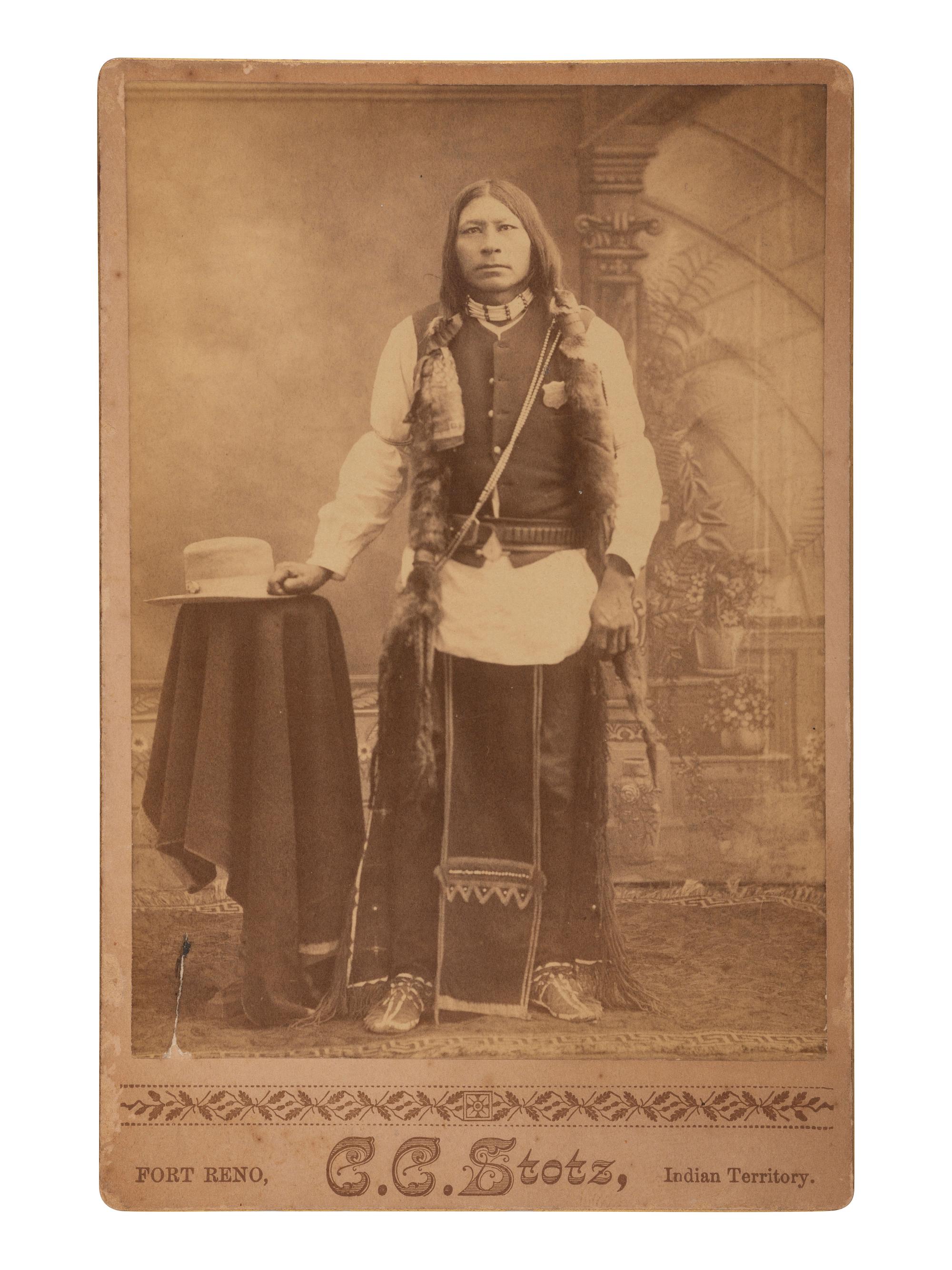 [NATIVE AMERICANS]. Cabinet card of an Arapahoe agency police officer. Fort Reno, Indian Territory: C.C. Stotz.