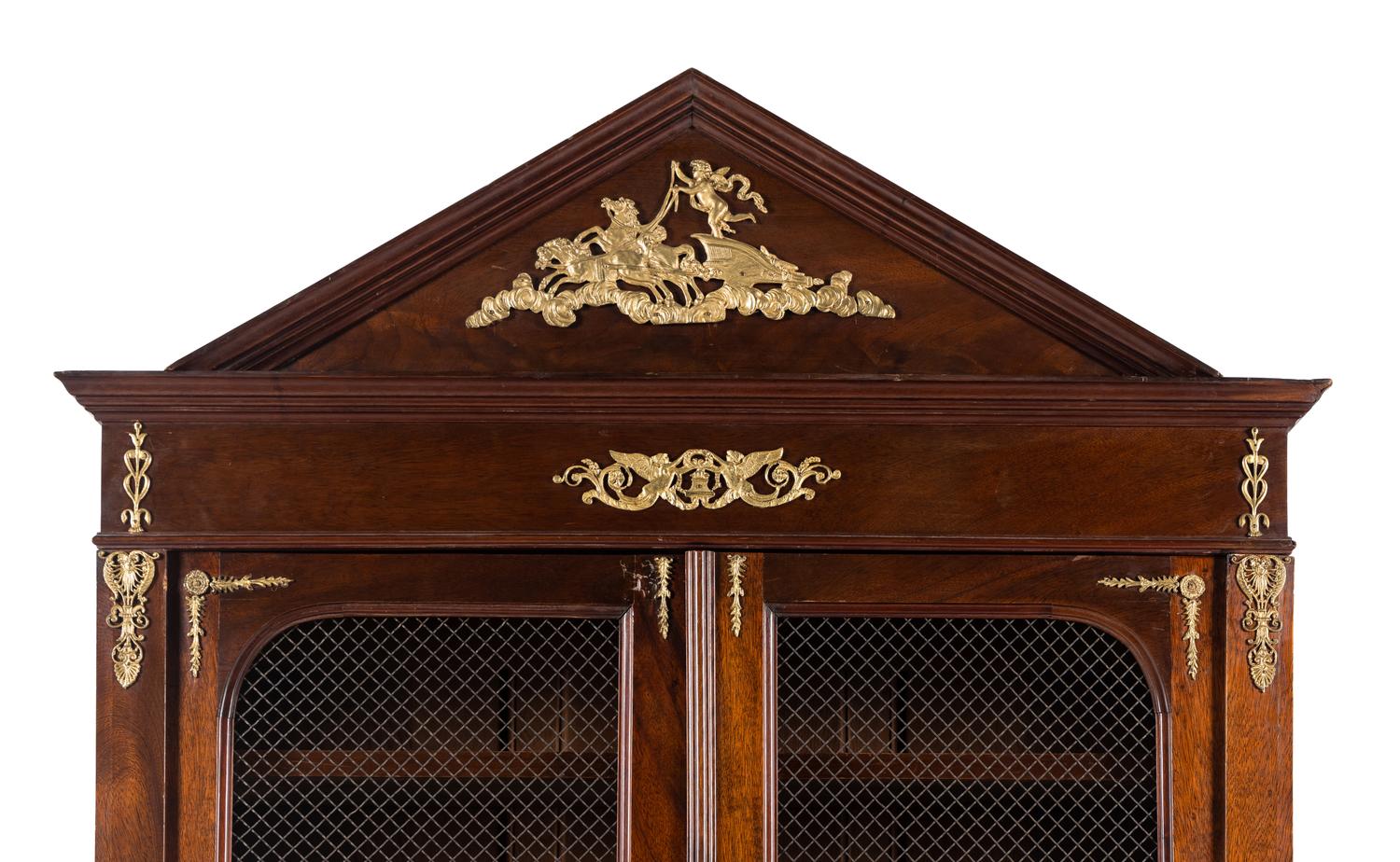 An Empire Style Gilt Metal Mounted Mahogany Bookcase