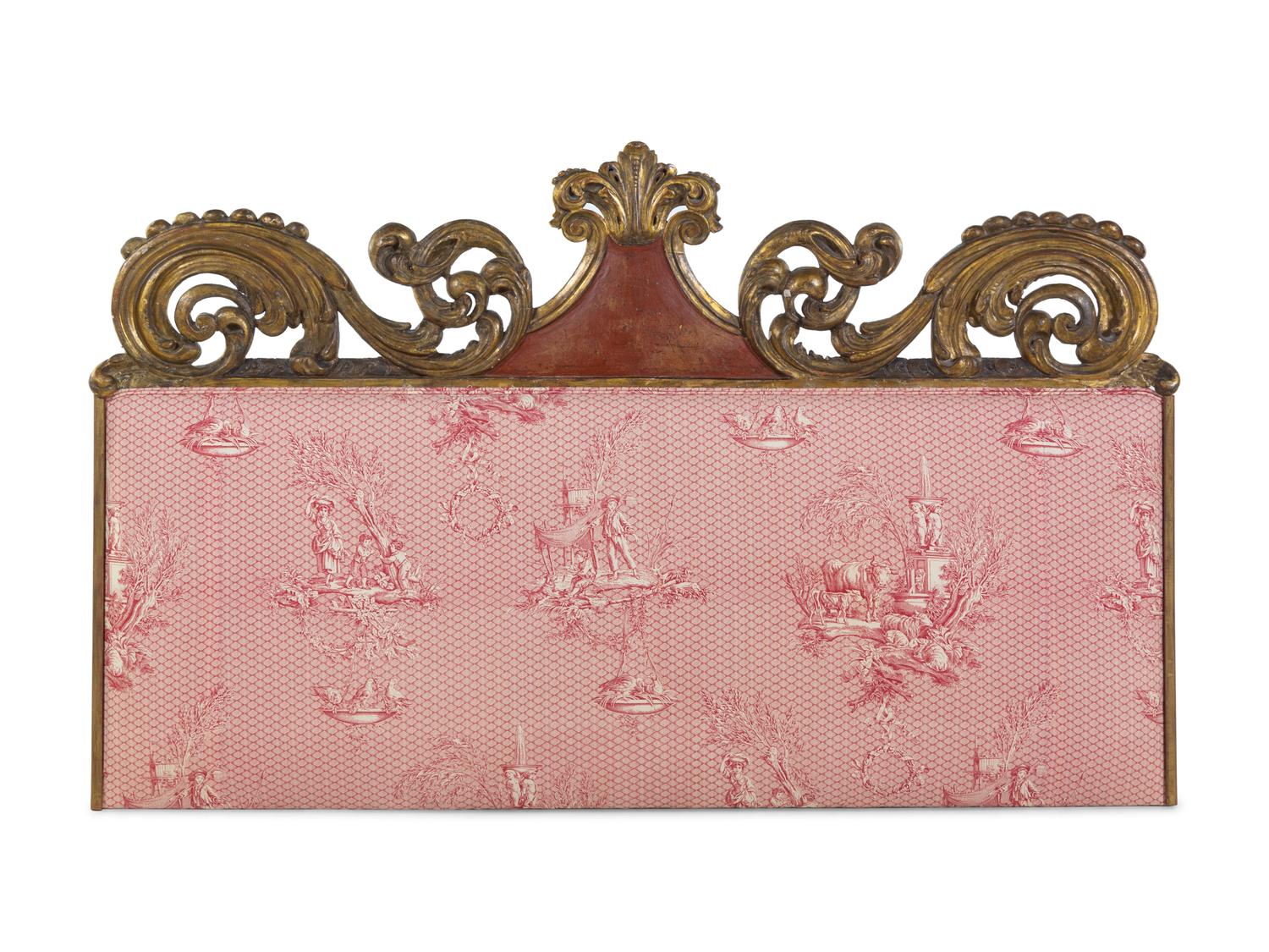 A Continental Carved and Parcel Gilt Wood Upholstered Headboard