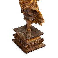 A Pair of Italian Painted and Parcel Gilt Figural Altar Prickets