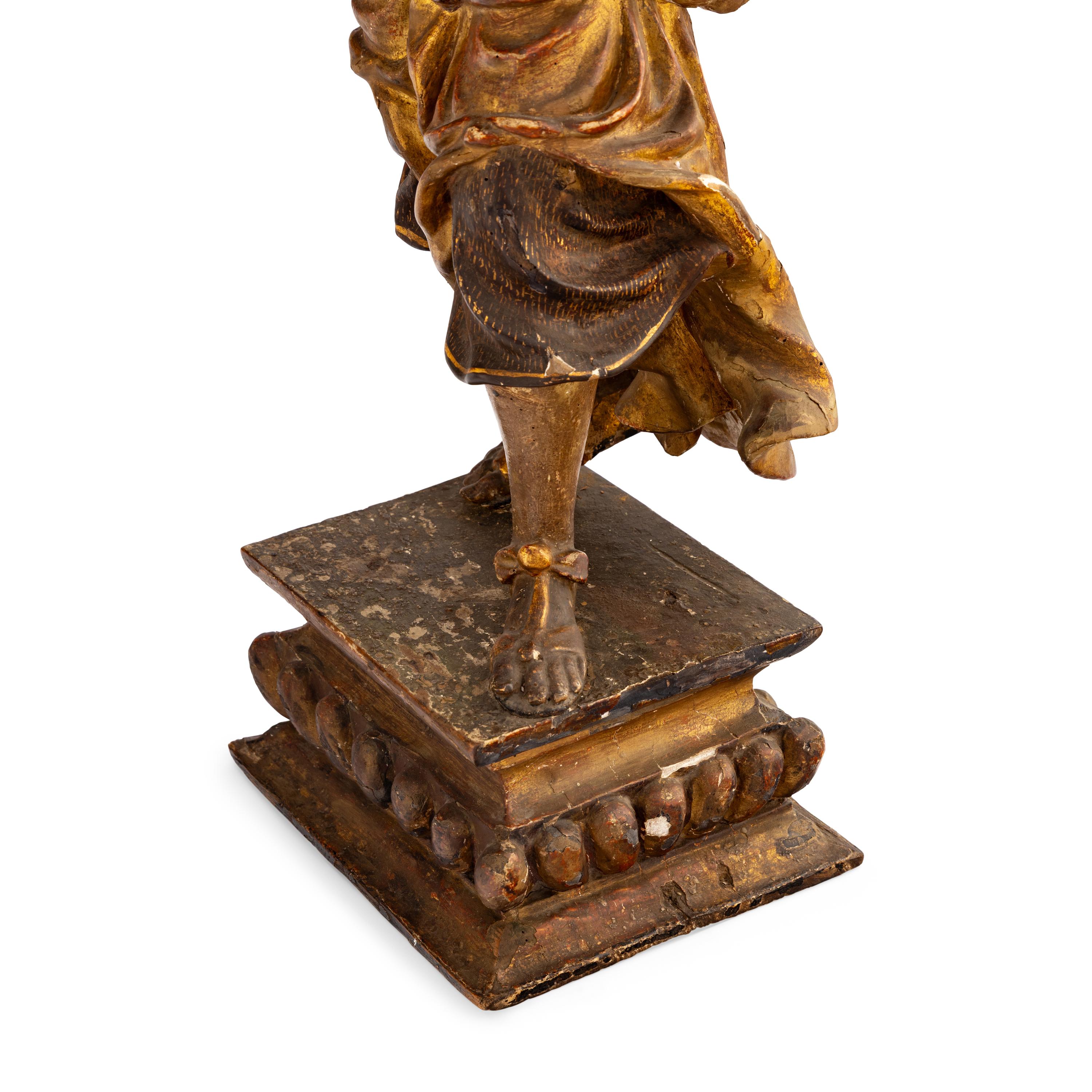 A Pair of Italian Painted and Parcel Gilt Figural Altar Prickets