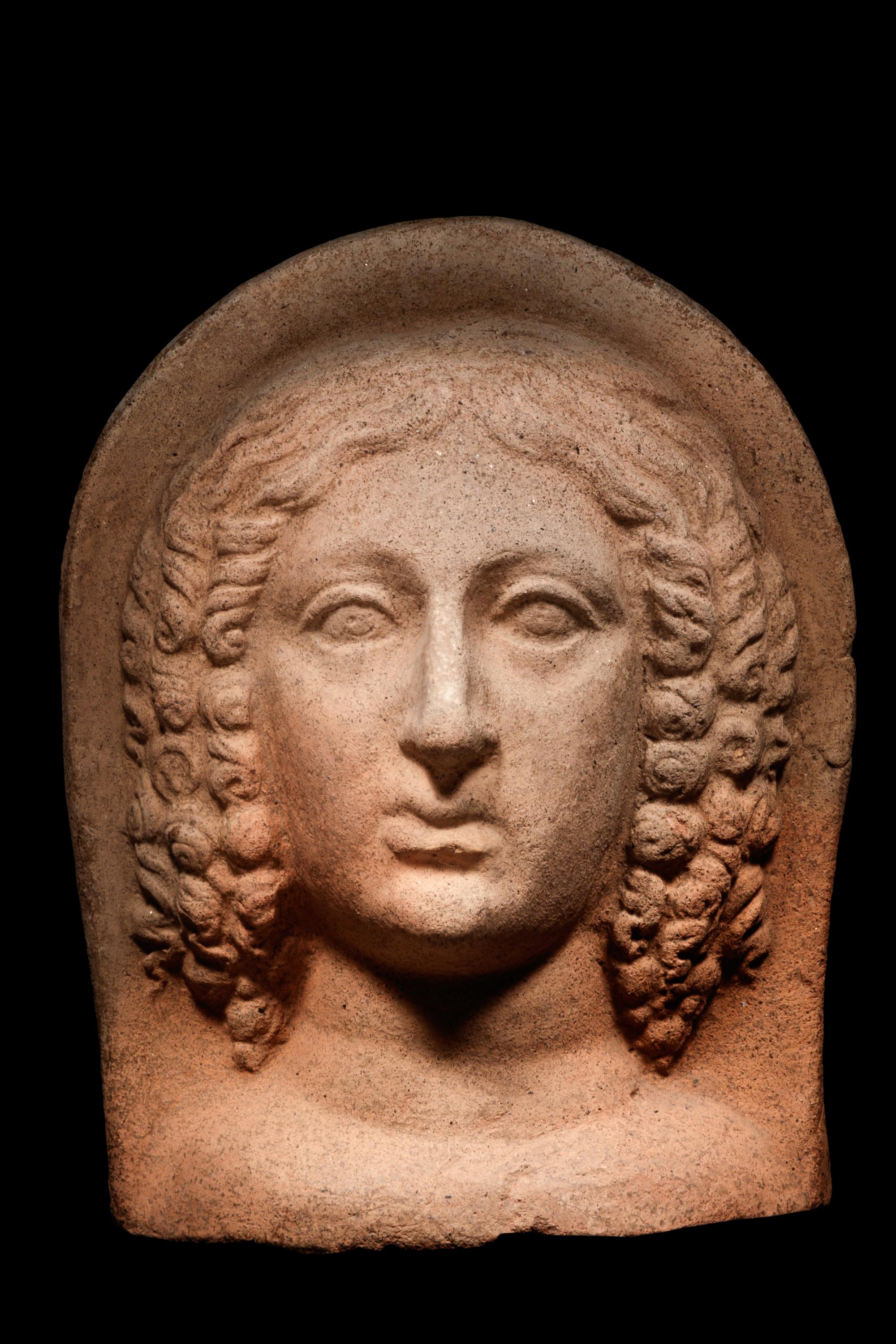 An Etruscan Terracotta Votive Head of a Woman