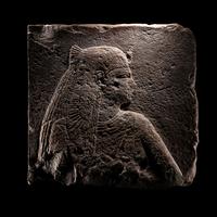An Egyptian Stone Relief Fragment of a Female Pharaoh or Goddess
