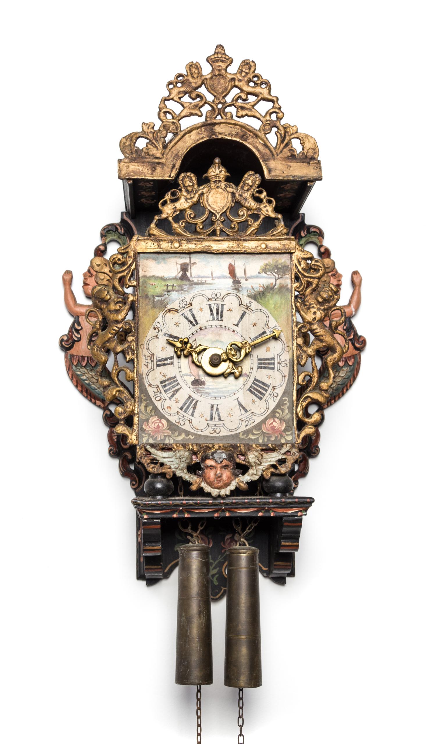 A Dutch Carved and Painted Wood Wall Clock Height 18 1/2 inches. — 18TH/19TH CENTURY