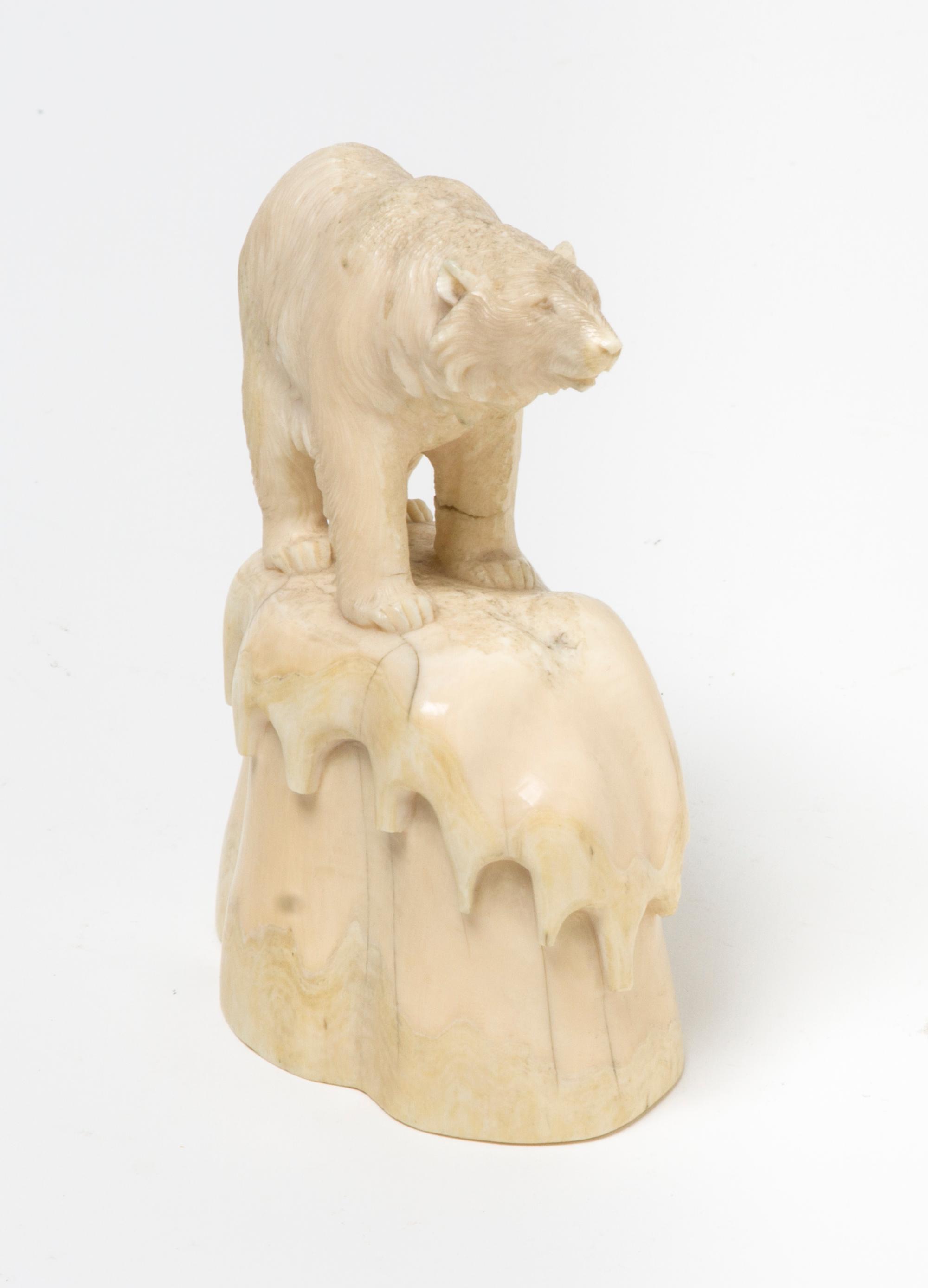 A Marine Ivory Carving of a Polar Bear, Height 4 1/2 inches.