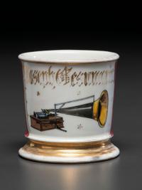 A Porcelain Shaving Mug Depicting a Cylinder Phonograph