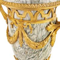 A Pair of Louis XVI Style Marble and Gilt Bronze Mounted Urns