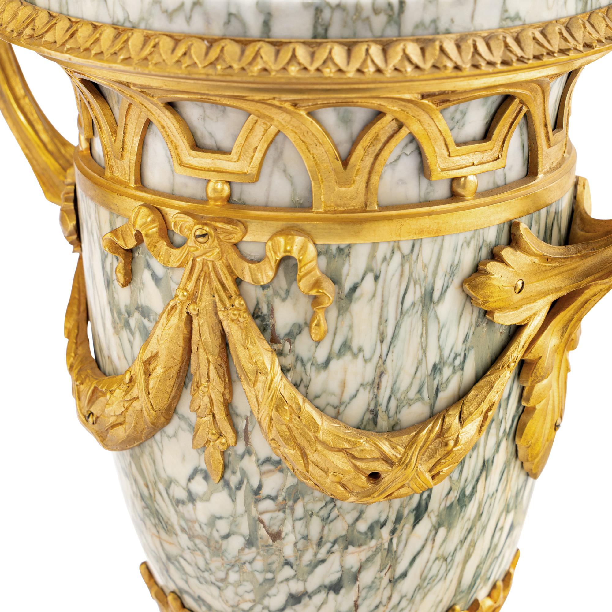 A Pair of Louis XVI Style Marble and Gilt Bronze Mounted Urns