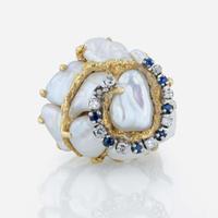 An 18K yellow gold, baroque cultured pearl, diamond, and sapphire ring