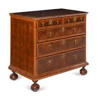 A William and Mary Oyster Walnut Chest of Drawers