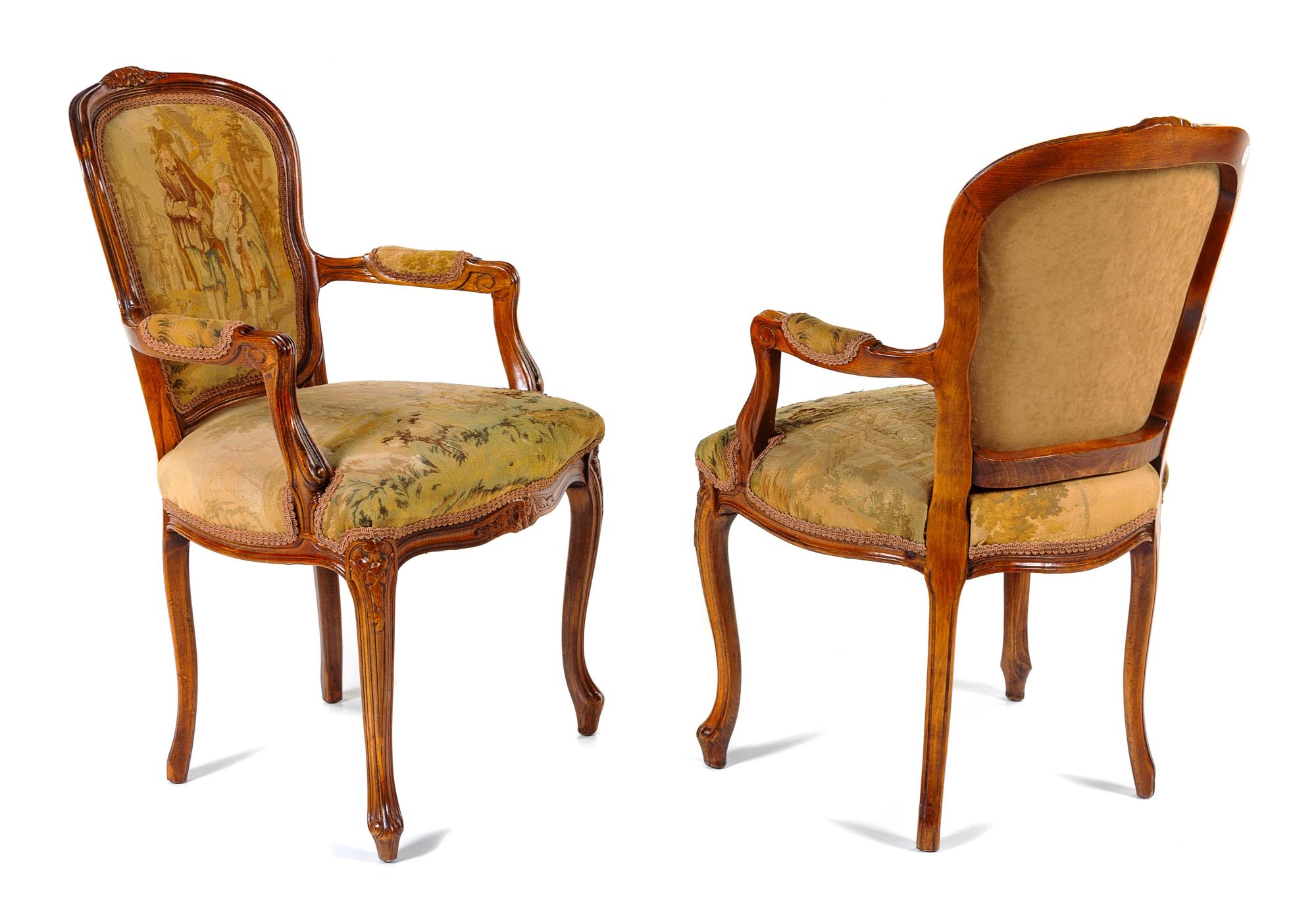 A Pair of Louis XV Fruitwood Fauteuils