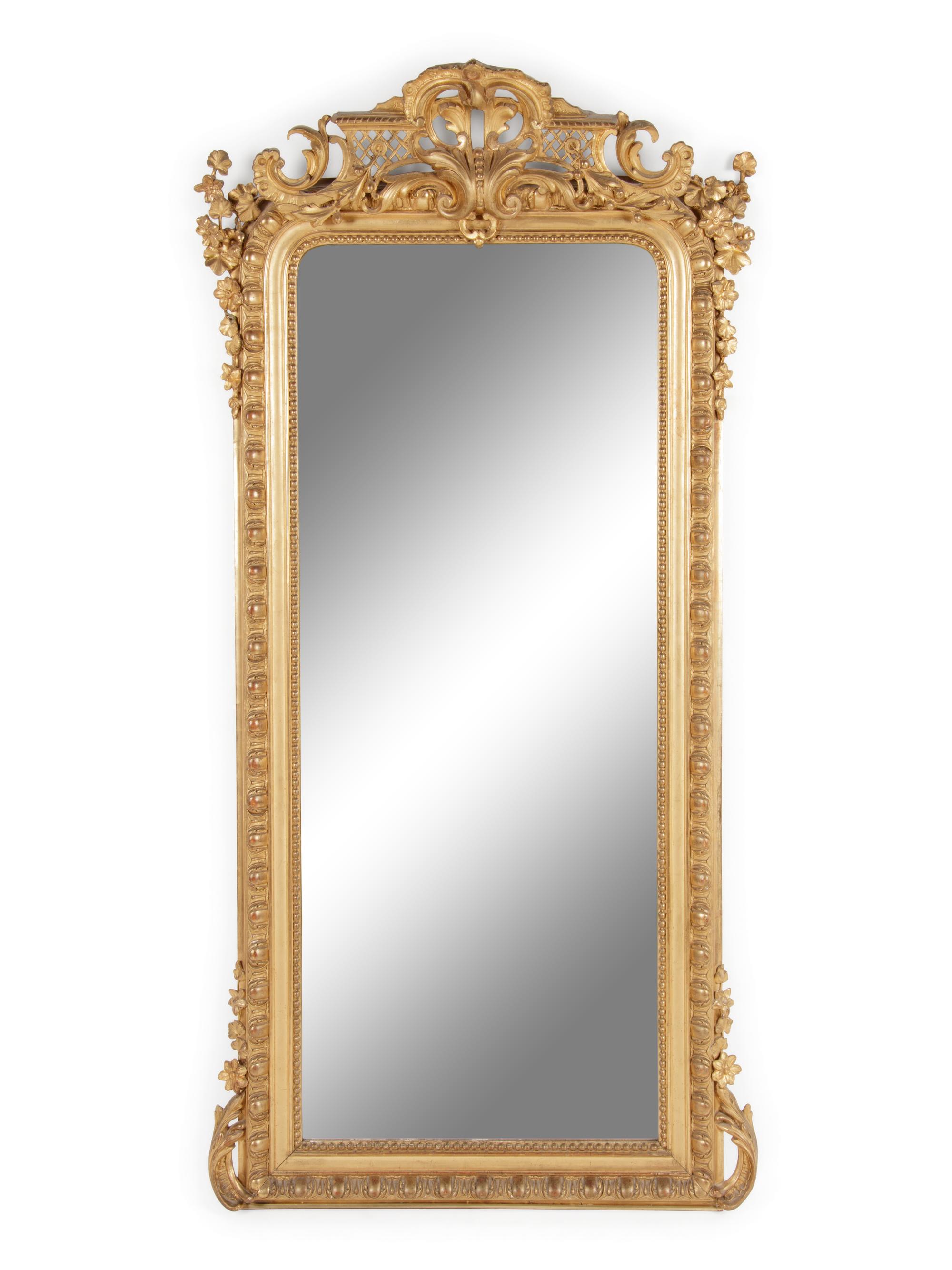 A Louis XVI Style Carved Giltwood Pier Mirror