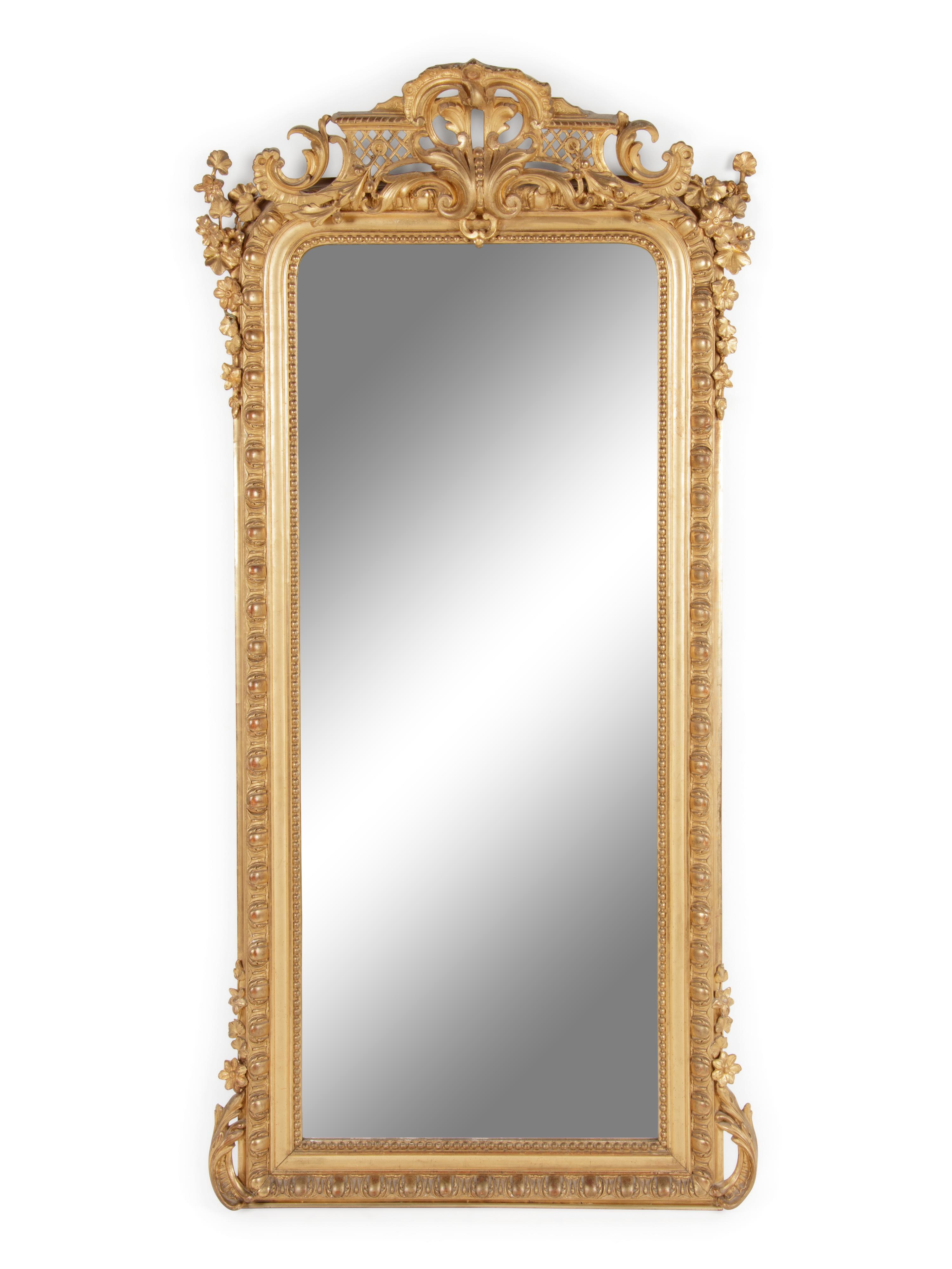 A Louis XVI Style Carved Giltwood Pier Mirror