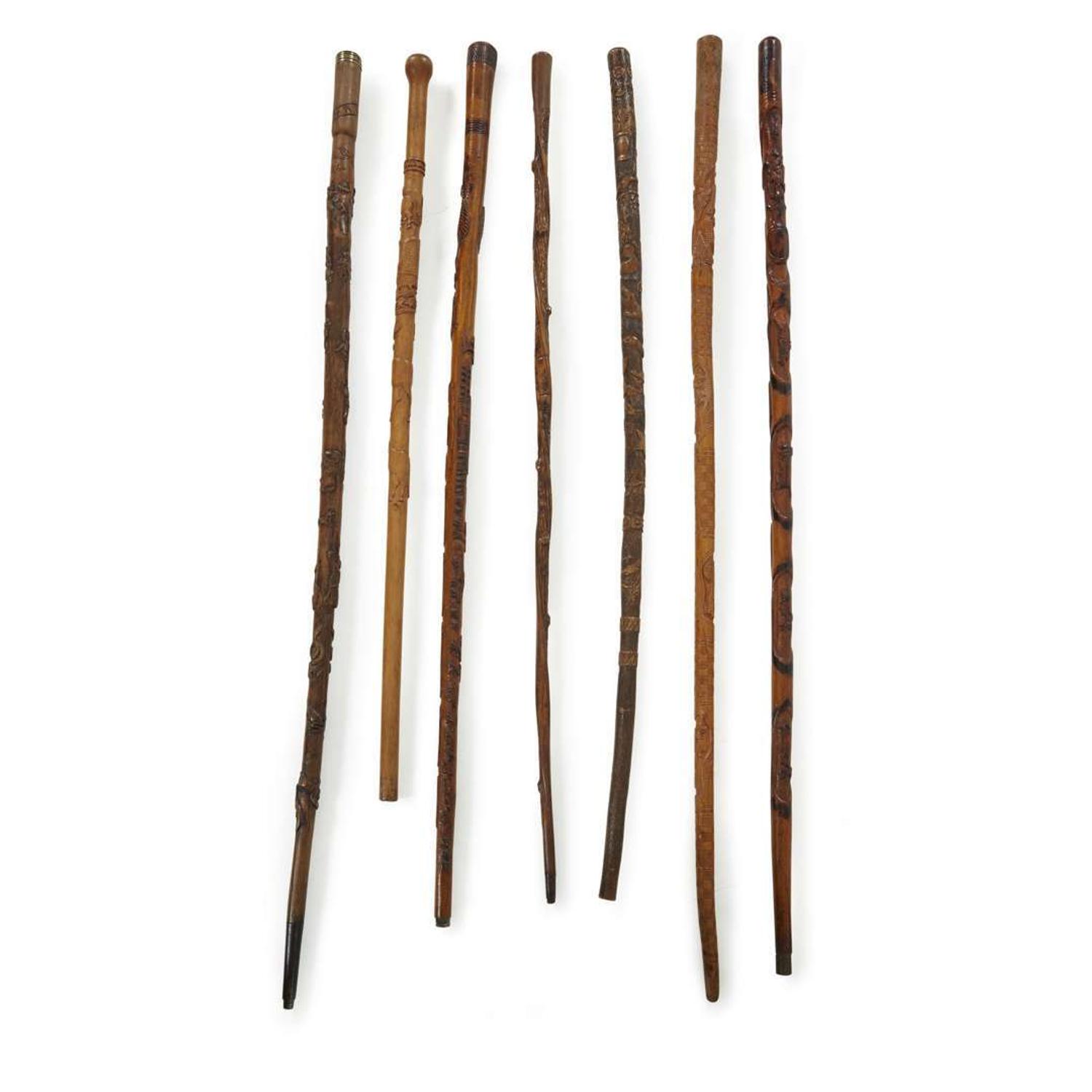 Group of seven carved wood canes with figural and patriotic motifs American and Mexican, late 19th/20th century