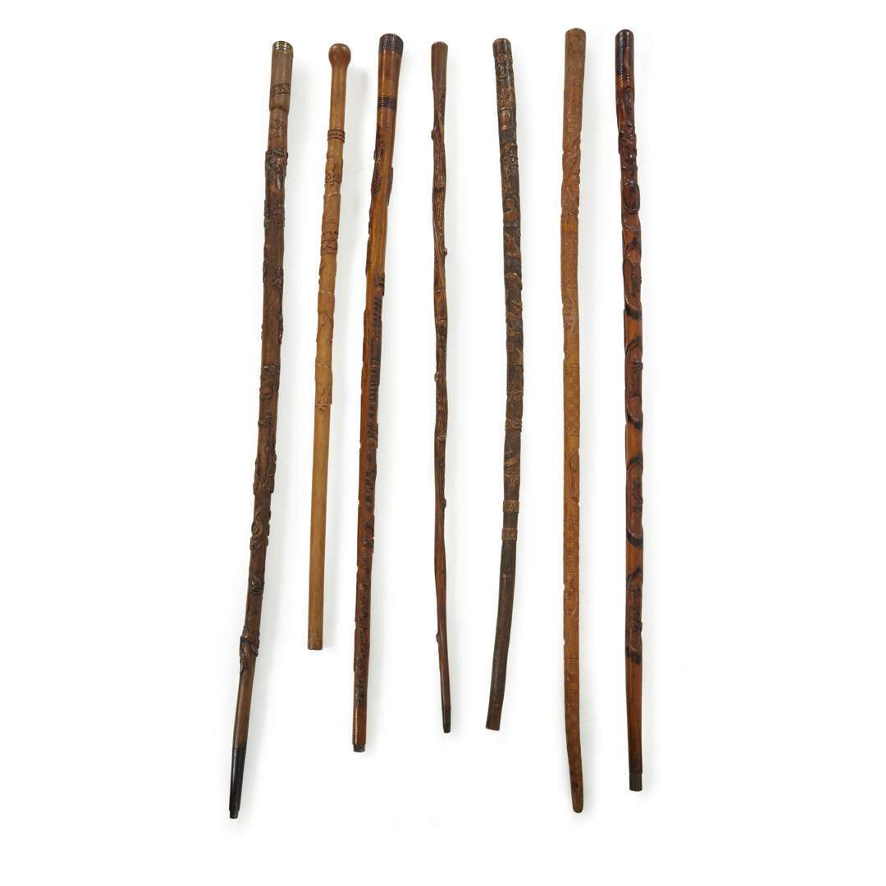 Group of seven carved wood canes with figural and patriotic motifs American and Mexican, late 19th/20th century