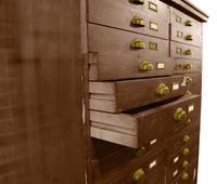 A Wooden File Cabinet 50" W x 29" D x 63" H — United States, 20th Century