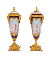 A Pair of Sèvres Style Gilt Bronze Mounted Painted, Parcel Gilt and "Jeweled" Porcelain Urns