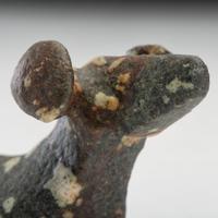 A Salvaged Porphyry Popeye Birdstone, with Red Ocher
