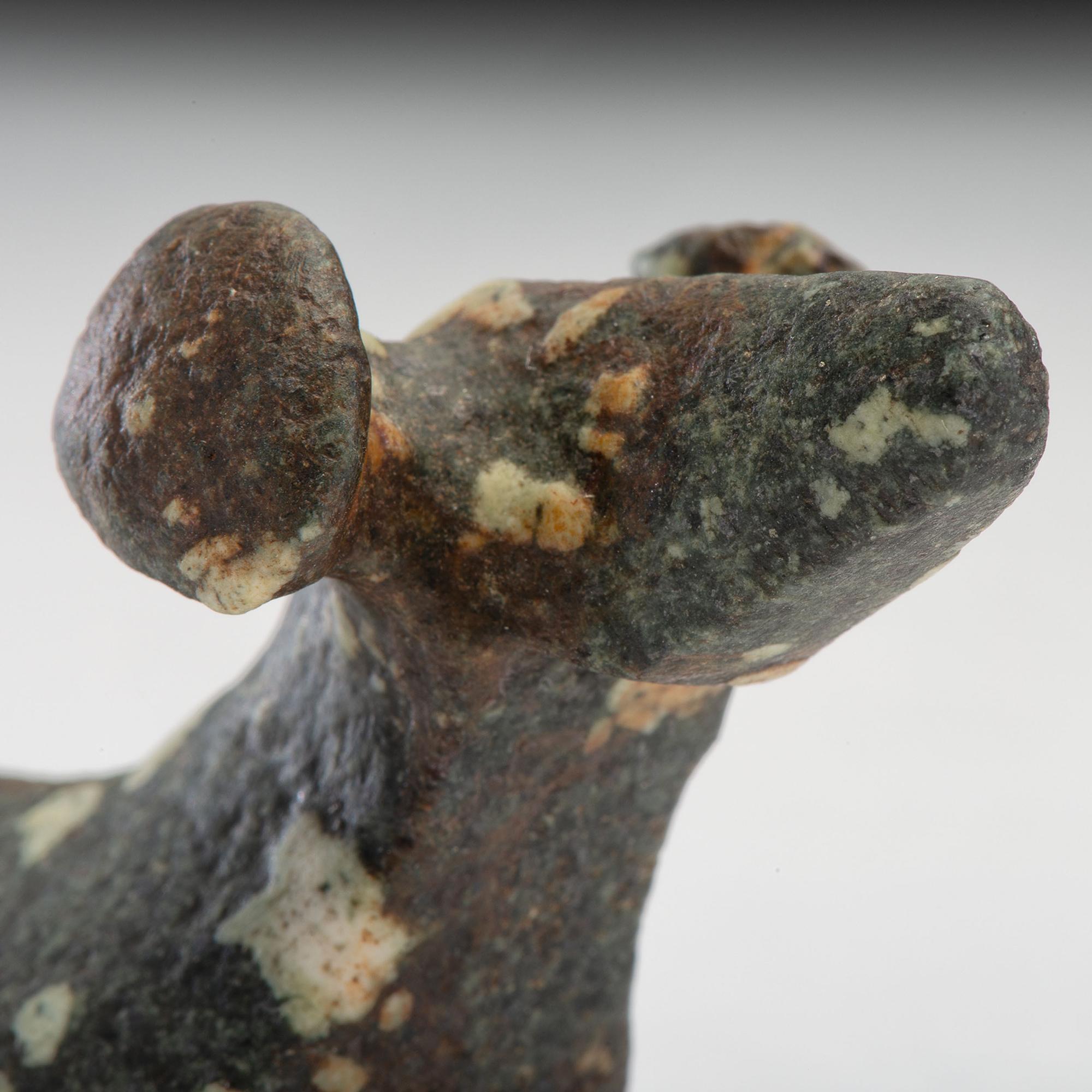A Salvaged Porphyry Popeye Birdstone, with Red Ocher