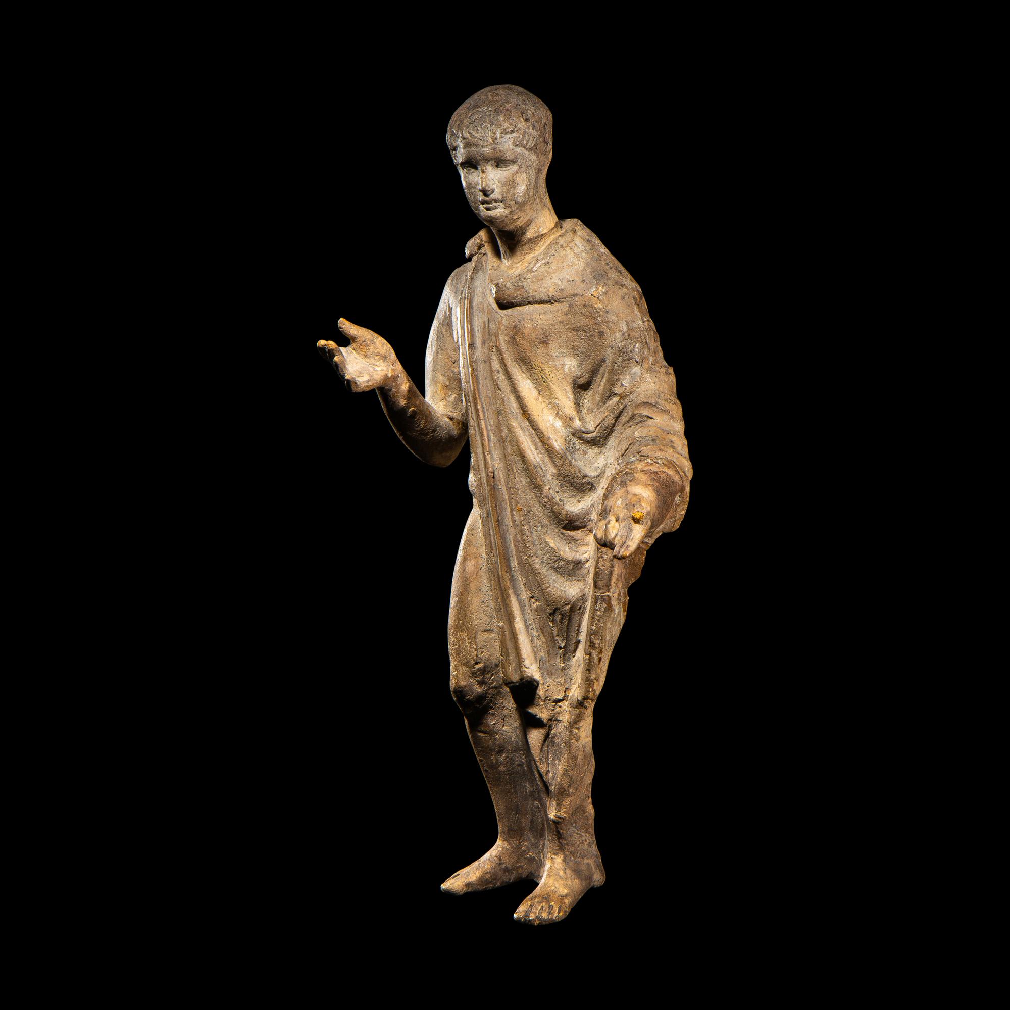 A Roman Terracotta Figure of a Youth