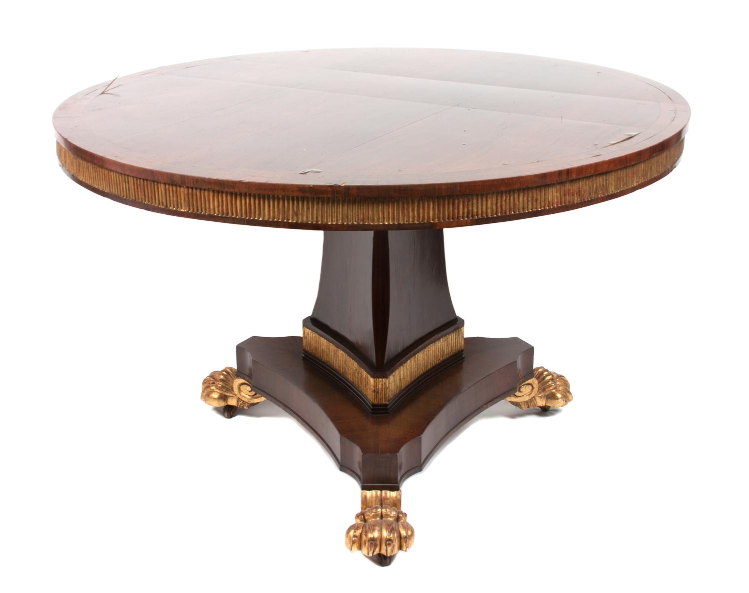 A Regency Brass Inlaid Mahogany Center Table Height 29 1/2 x diameter 48 inches.