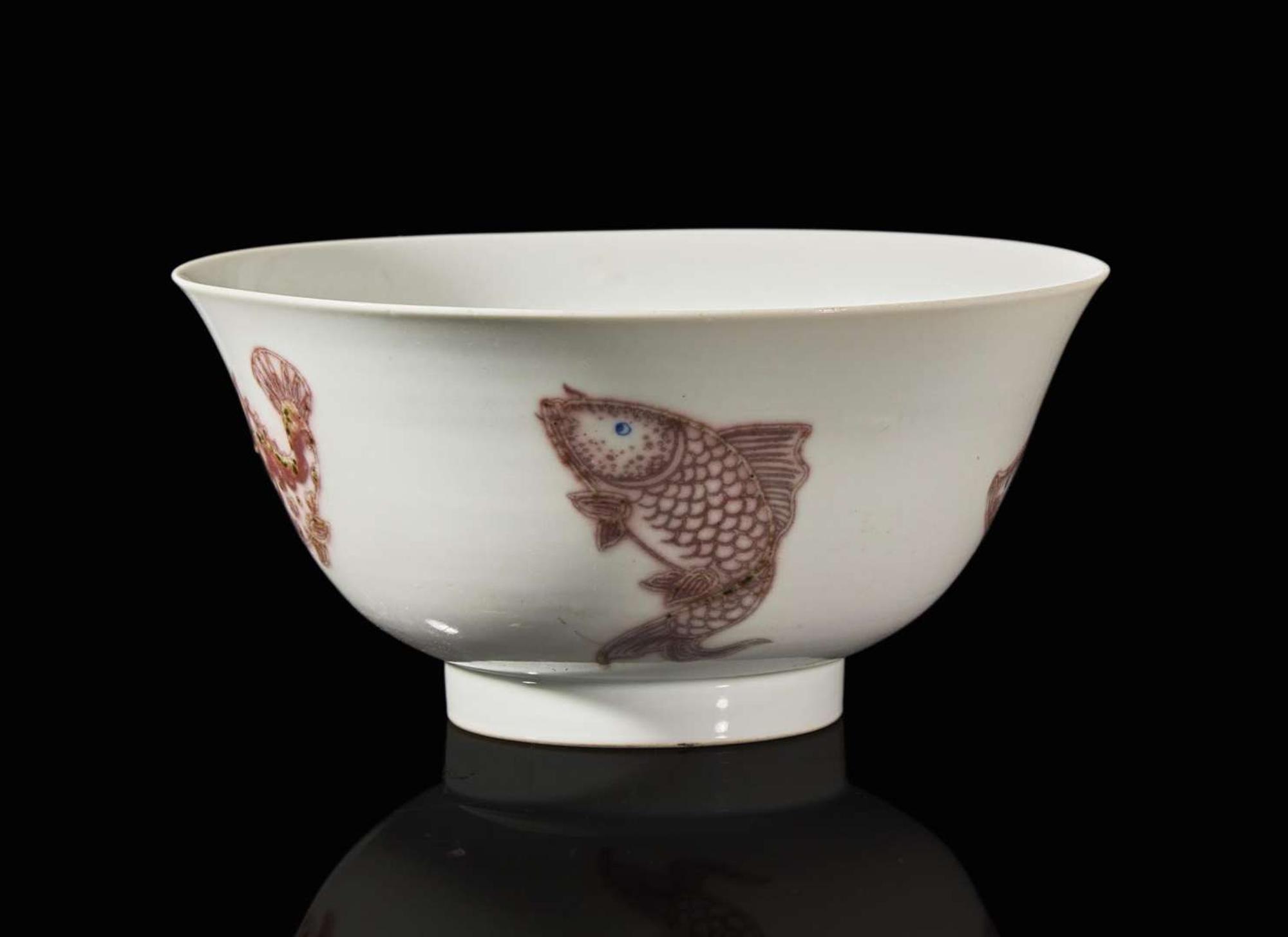 A Chinese underglaze red and blue-decorated "Fishes" bowl, Kangxi period 青花釉裡紅盌 清 康熙