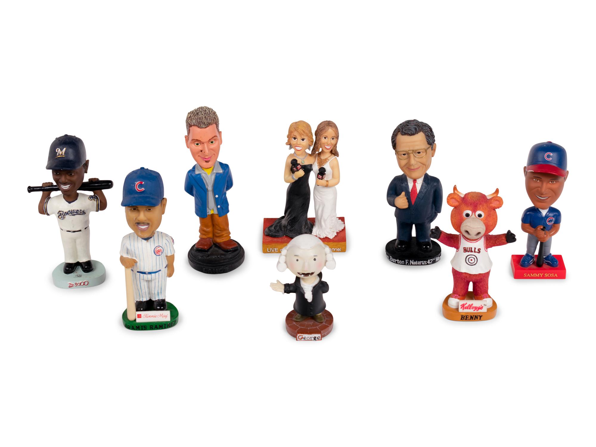 (Celebrity Memorabilia) A group of 8 bobbleheads, comprising: