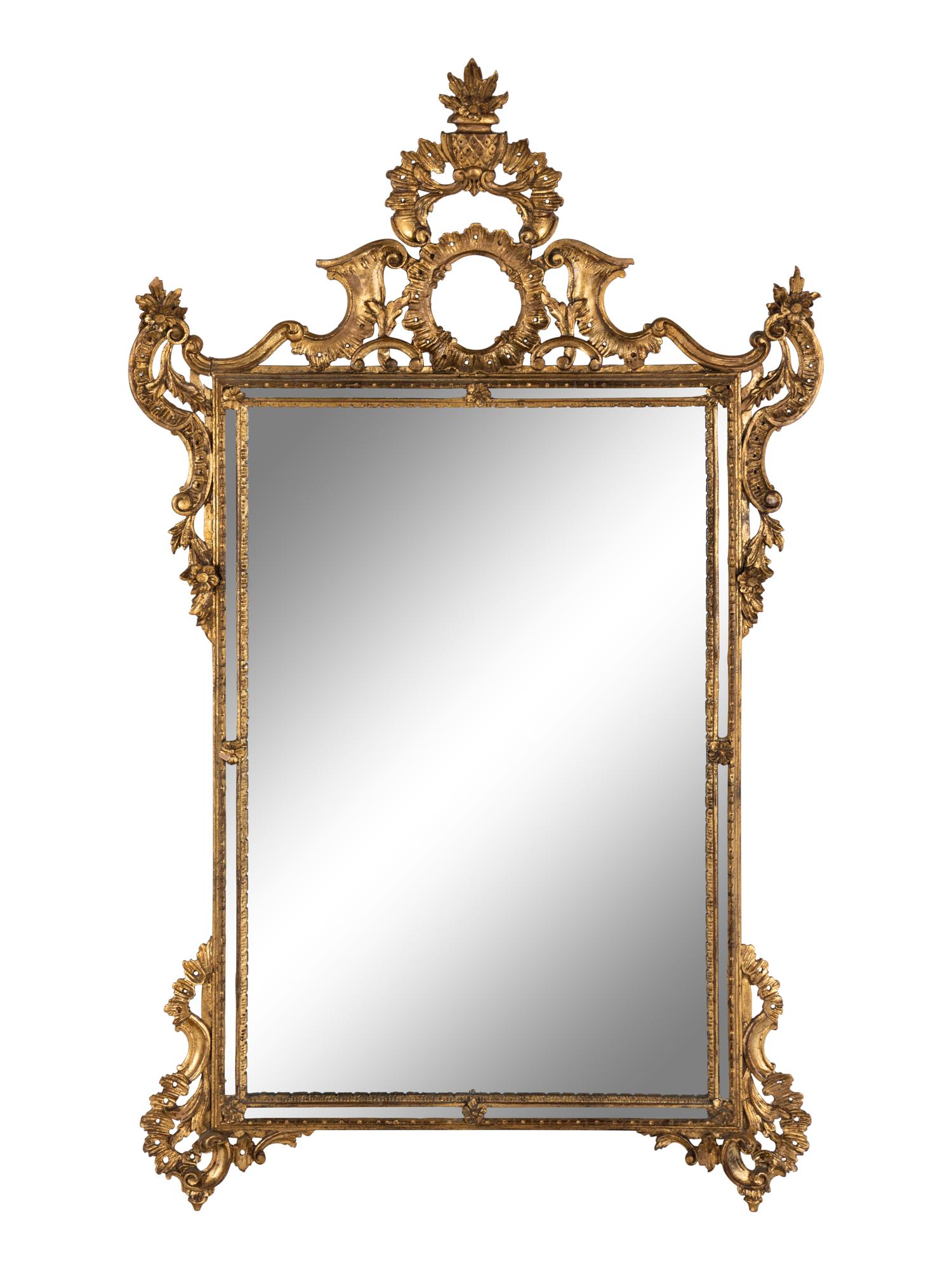 An Italian Baroque Style Giltwood Mirror