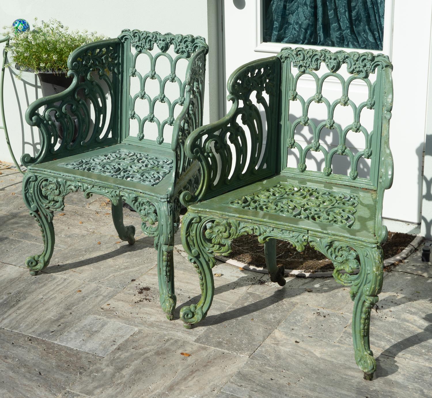 A Green-Painted Metal Garden Bench and Pair of Armchairs