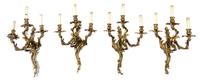 A Group of Four Louis XV Style Gilt Bronze Three-Light Wall Sconces Height 24 inches.