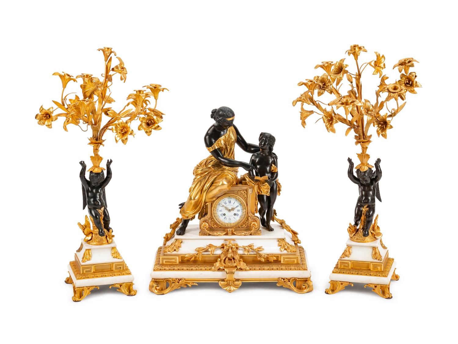 A Napoleon III Parcel-Gilt, Patinated Bronze and Marble Three-Piece Clock Garniture — THE DIAL INSCRIBED J B MARCHAND, PARIS, 19TH CENTURY