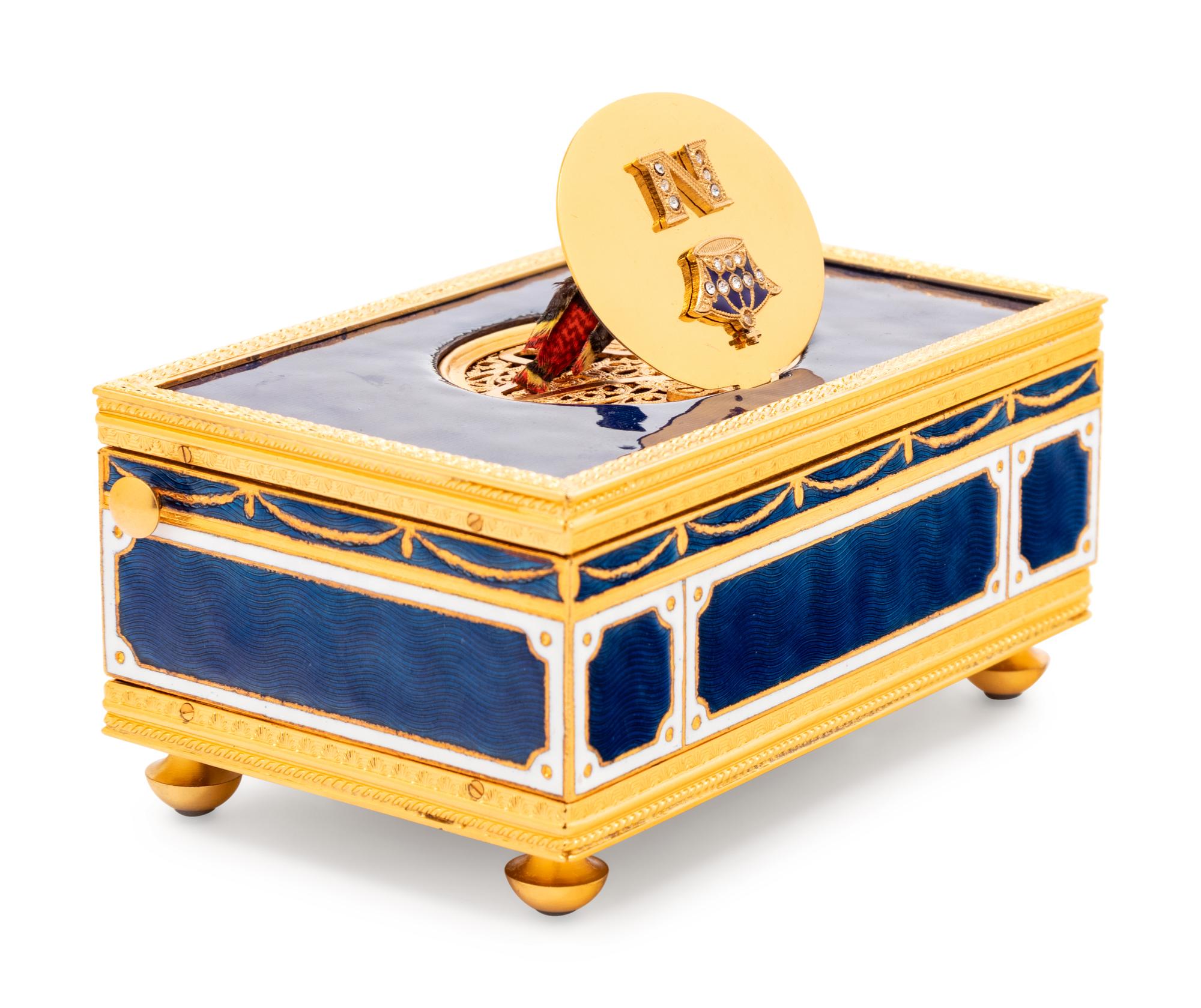 A Reuge Gilt Metal Mounted and Rhinestone-Inset Enameled Singing Bird Automaton Box